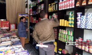 Employees of the Directorate of Supply and Consumer Protection in Ras al-Ain inspect products in a store in Ras al-Ain - May 16, 2024 (Enab Baladi)