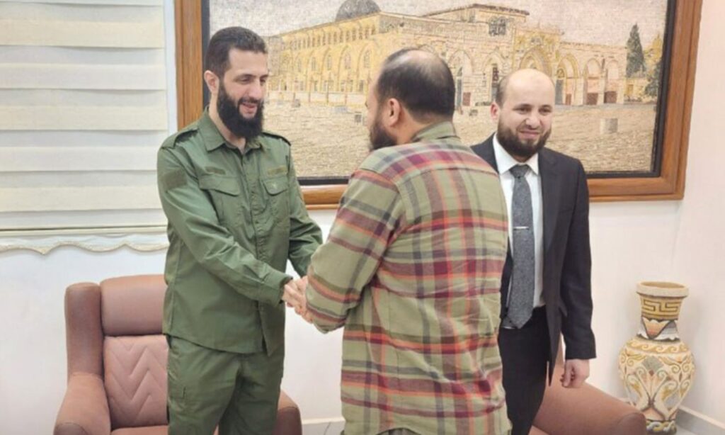 The head of the Syrian Salvation Government, Mohamed al-Bashir (right), and Abu Mohammad al-Jolani, leader of Hayat Tahrir al-Sham, during Eid gathering with some displaced residents in Idlib - April 10, 2024 (Amjad media)