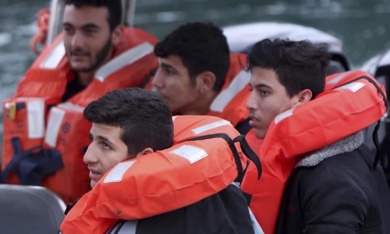 Migrants on a Cypriot police boat after their ship was rescued - January 2024 (AP)