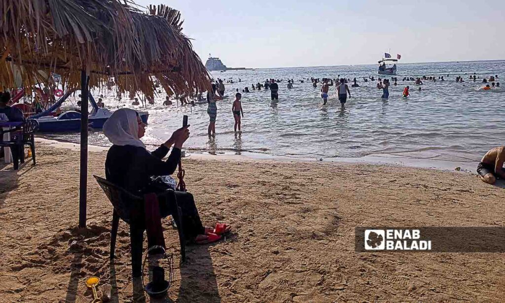 The Karnak Beach is a popular tourism site in the Blue Beach area in Latakia - July 23, 2024 (Enab Baladi/Linda Ali)