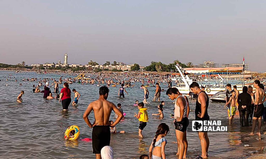 Young people on the Karnak Beach in the Blue Beach area in Latakia - July 23, 2024 (Enab Baladi/Linda Ali)