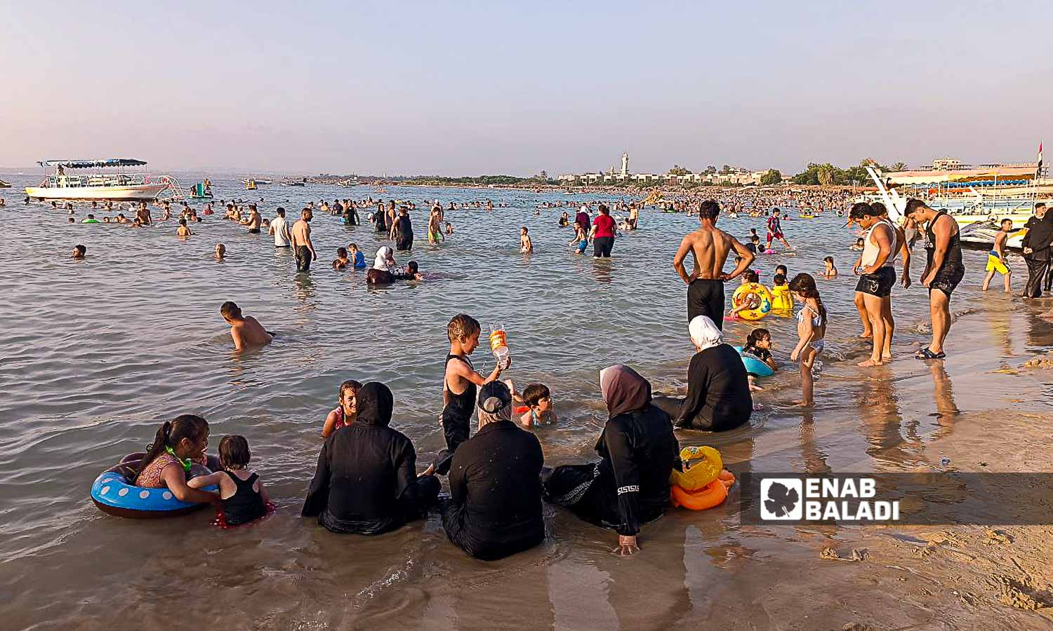 Residents flock to the beaches to escape the summer heat in Latakia - July 23, 2024 (Enab Baladi/Linda Ali)