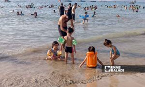 The Karnak Beach is a popular tourism site in the Blue Beach area in Latakia - July 23, 2024 (Enab Baladi/Linda Ali)