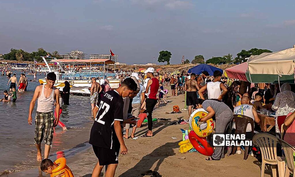 The Karnak Beach is a popular tourism site in the Blue Beach area in Latakia - July 23, 2024 (Enab Baladi/Linda Ali)