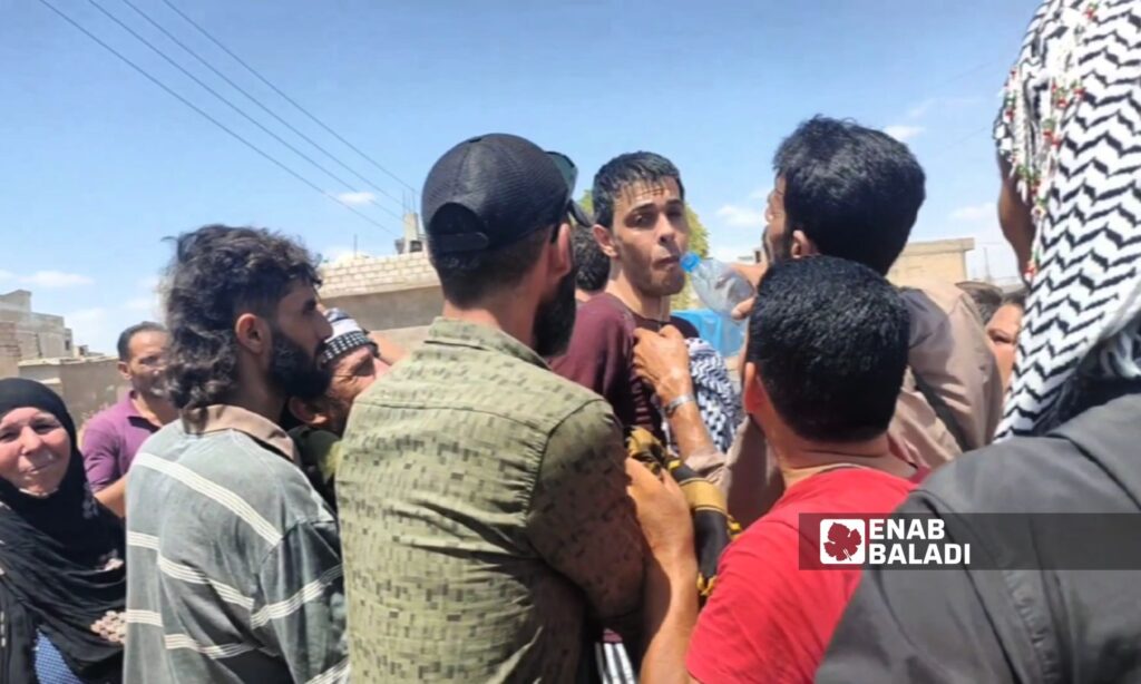 Civilians welcome a released prisoner from Alaya Prison in al-Hasakah province, northeastern Syria - July 22, 2024 (Enab Baladi/Majd al-Salem)