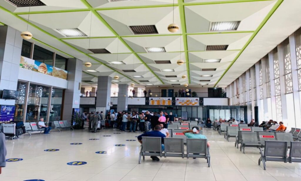 Travelers wait for their flights inside Damascus International Airport, October 2020 (Al-Mamlaka)