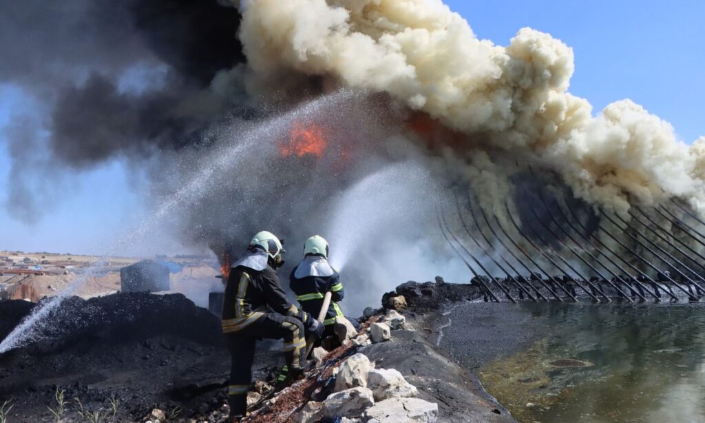 Elements of the Syria Civil Defence (White Helmets) extinguishing a fire in northwestern Syria - (Syria Civil Defence/Facebook)