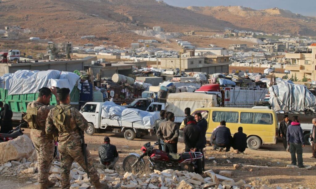 Syrian refugees prepare to leave their camp in Lebanon heading towards Syria - October 26, 2022 (AFP)