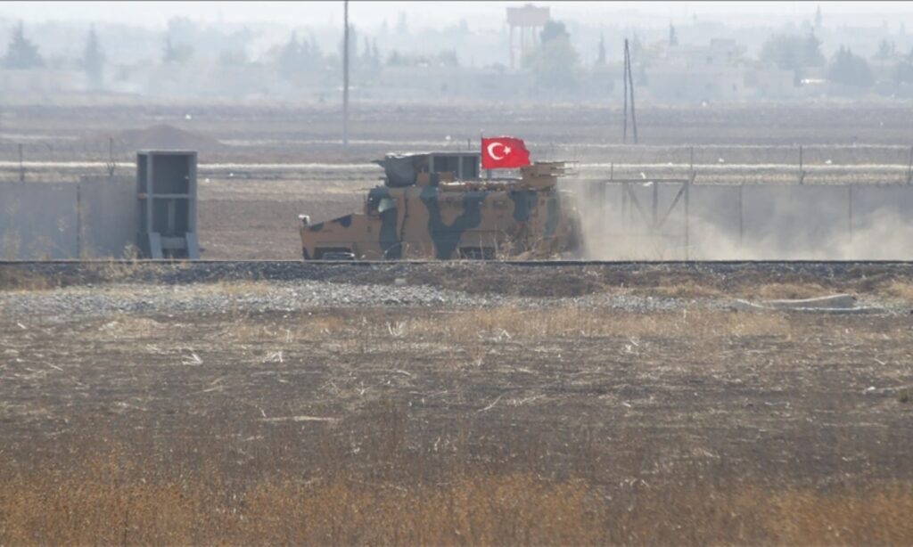 A Turkish armored vehicle prepares to cross the border wall separating Turkey and Syria at an unspecified location and date (Anadolu Agency)