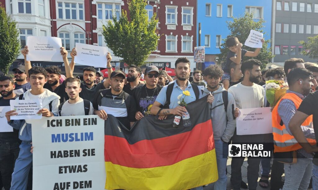 Syrians show solidarity with the families of the victims of the Solingen stabbing attack in Germany - August 31, 2024 (Enab Baladi/Hassan Ibrahim)