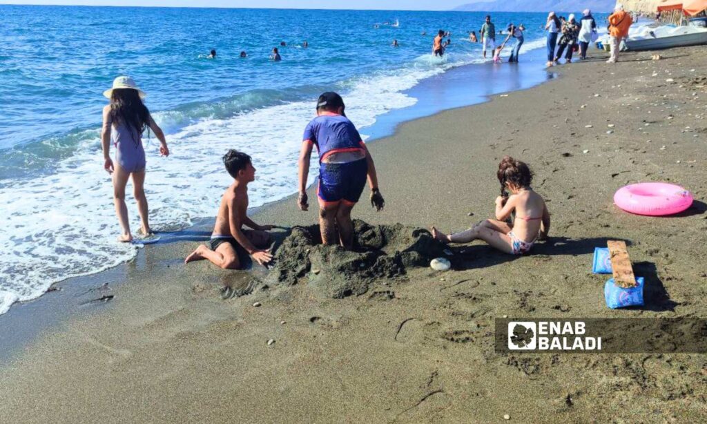 Children playing in Wadi Qandil Beach in Latakia - September 15, 2024 (Enab Baladi/Linda Ali)