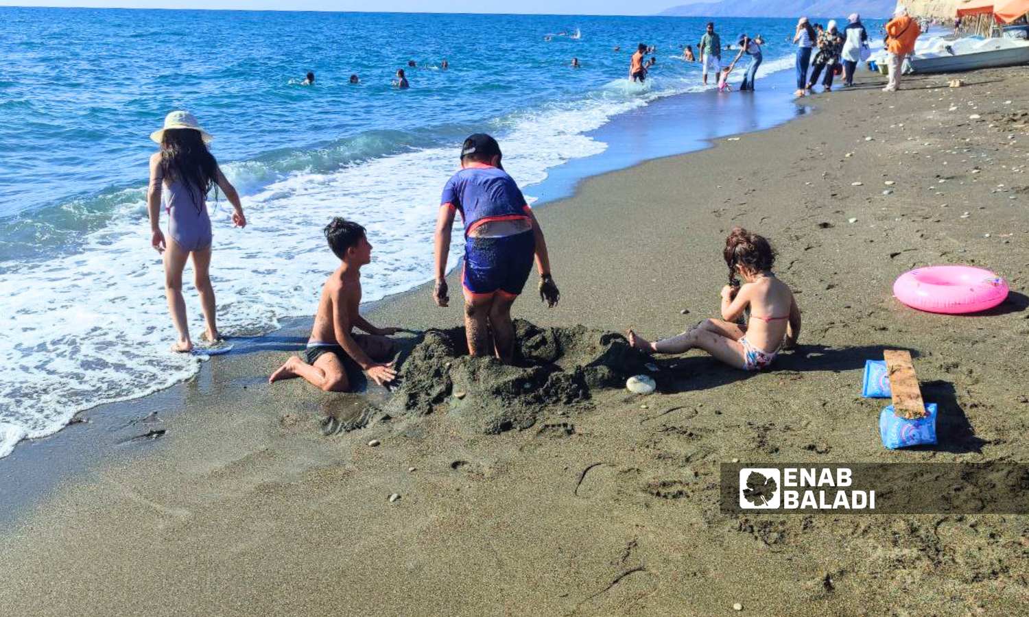 Children playing in Wadi Qandil Beach in Latakia - September 15, 2024 (Enab Baladi/Linda Ali)
