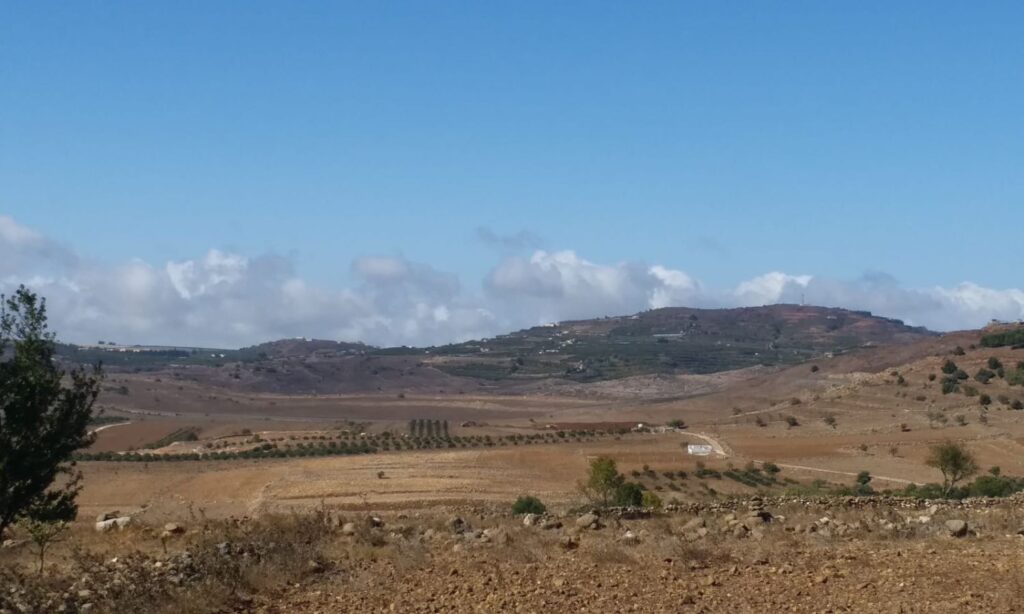 A photo showing Israel bulldozing agricultural land and digging trenches around Jubata al-Khashab village in Quneitra - September 21, 2024 (Enab Baladi)