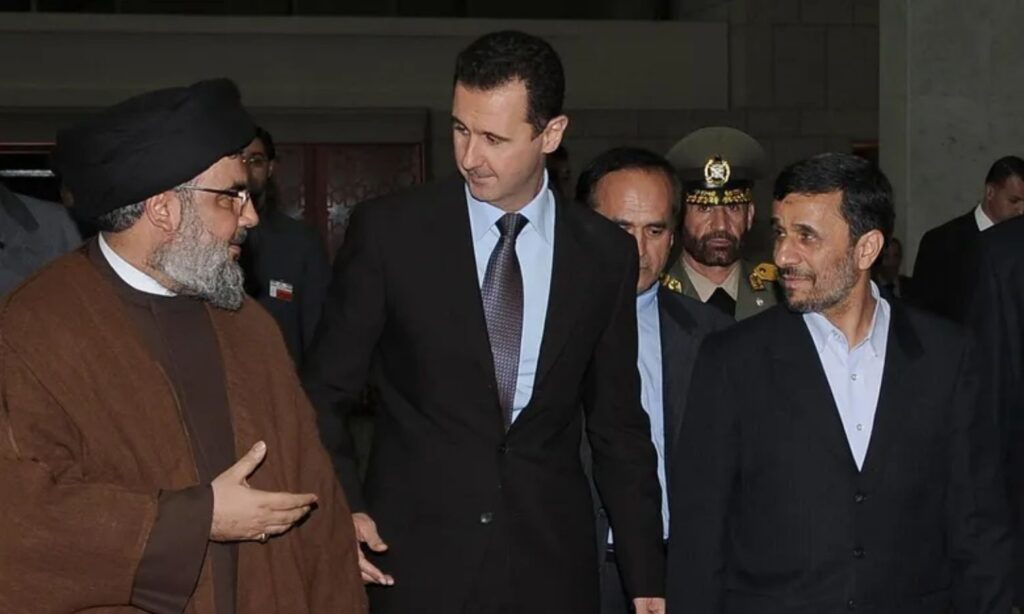 Syrian regime president Bashar al-Assad (center), Hezbollah leader Hassan Nasrallah (left), and former Iranian president Mahmoud Ahmadinejad (right) in the Syrian capital, Damascus (SANA)