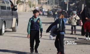 Students leave school after the end of their classes in the city of al-Basira in eastern Deir Ezzor countryside - January 17, 2024 (Enab Baladi)