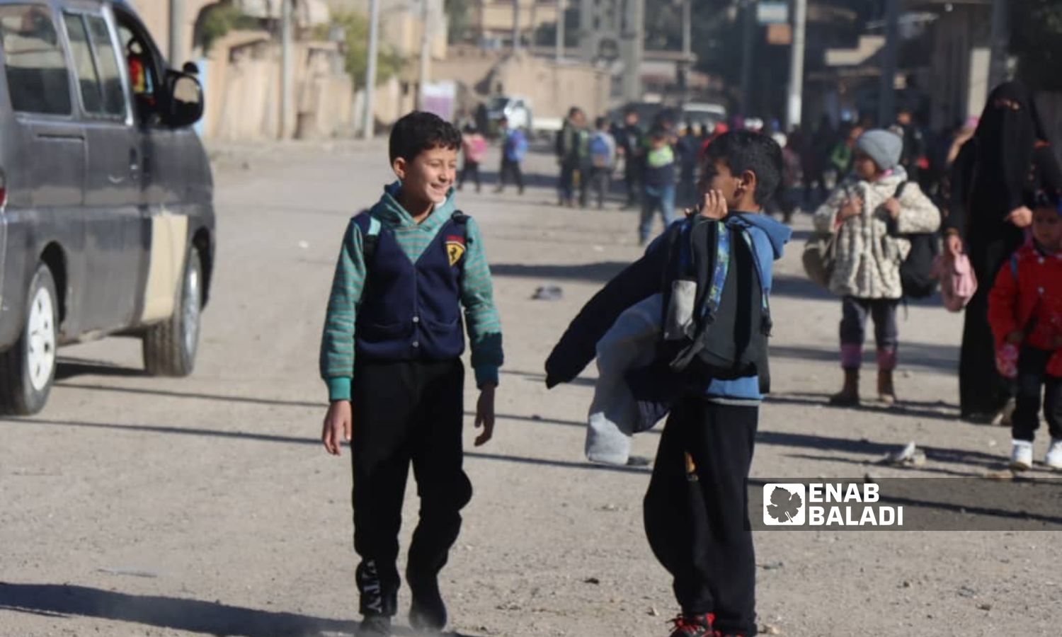 Students leave school after the end of their classes in the city of al-Basira in eastern Deir Ezzor countryside - January 17, 2024 (Enab Baladi)