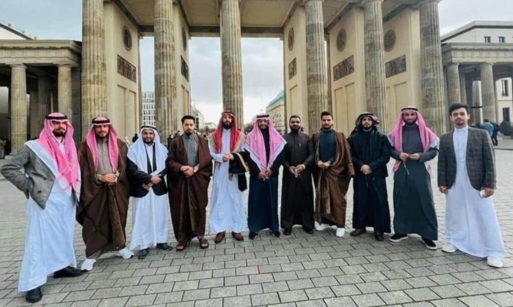 A group of Syrian tribesmen in front of the Brandenburg Gate in the German capital, Berlin - April 2022 (Germany News/Facebook)