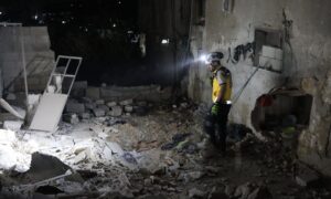 A Syria Civil Defence member inspects a site targeted by regime forces in Darat Izza, Aleppo countryside - October 6, 2024 (Syria Civil Defence)
