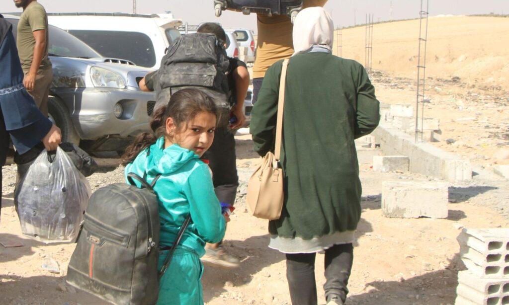 Syrians coming from Lebanon after crossing from the Aoun al-Dadat crossing in rural Aleppo - October 13, 2024 (Syria Civil Defence/Facebook)