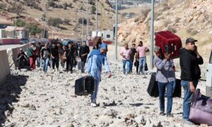 Syrians and Lebanese during border crossing at Masnaa after it was bombed - October 4, 2024 (Reuters)