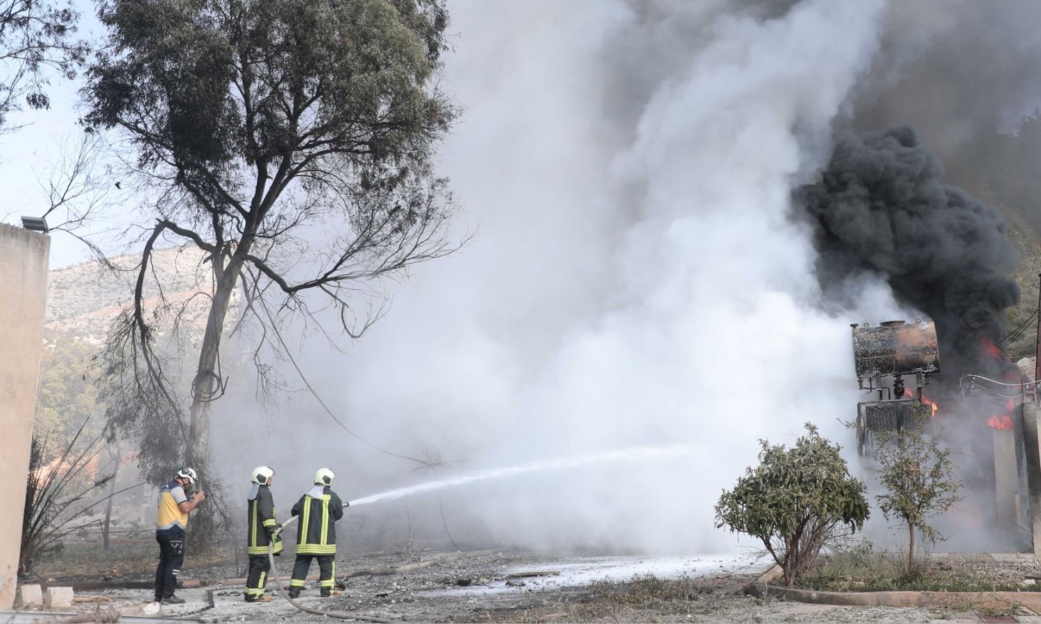 Members of the Syria Civil Defence work to extinguish a fire that broke out at a power station following a Russian bombing in the rural area of Idlib - October 15, 2024 (Syria Civil Defence)