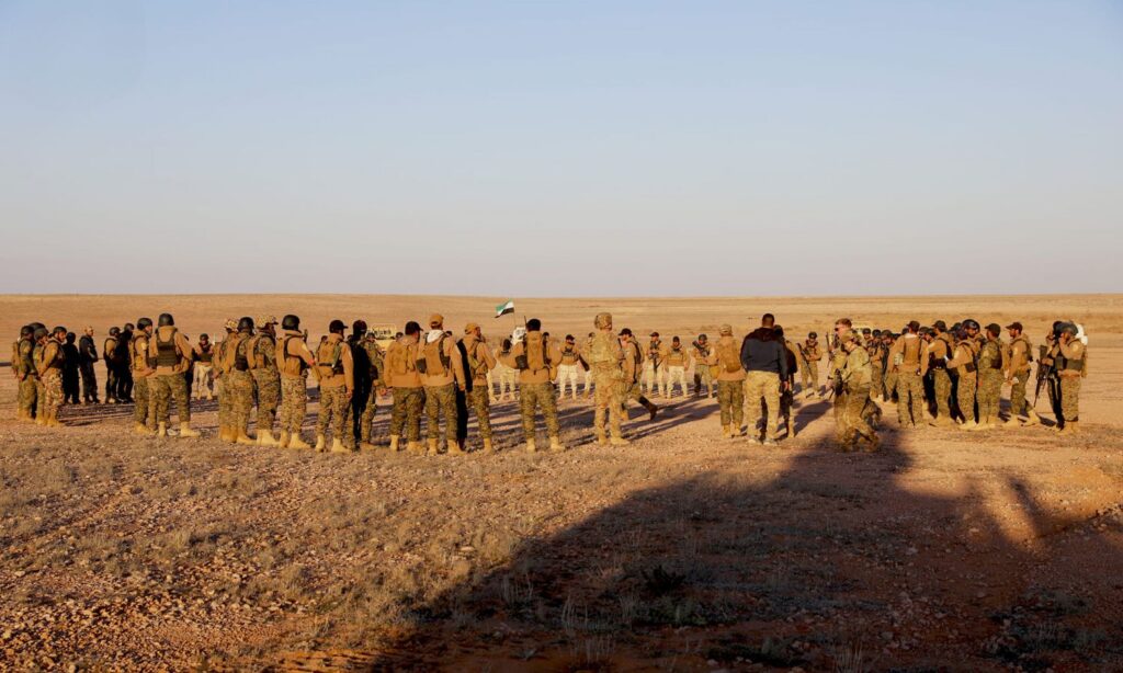 Fighters from the Free Syrian Army alongside US soldiers at the al-Tanf military base in eastern Syria during training - April 4, 2024 (Free Syrian Army/Facebook)