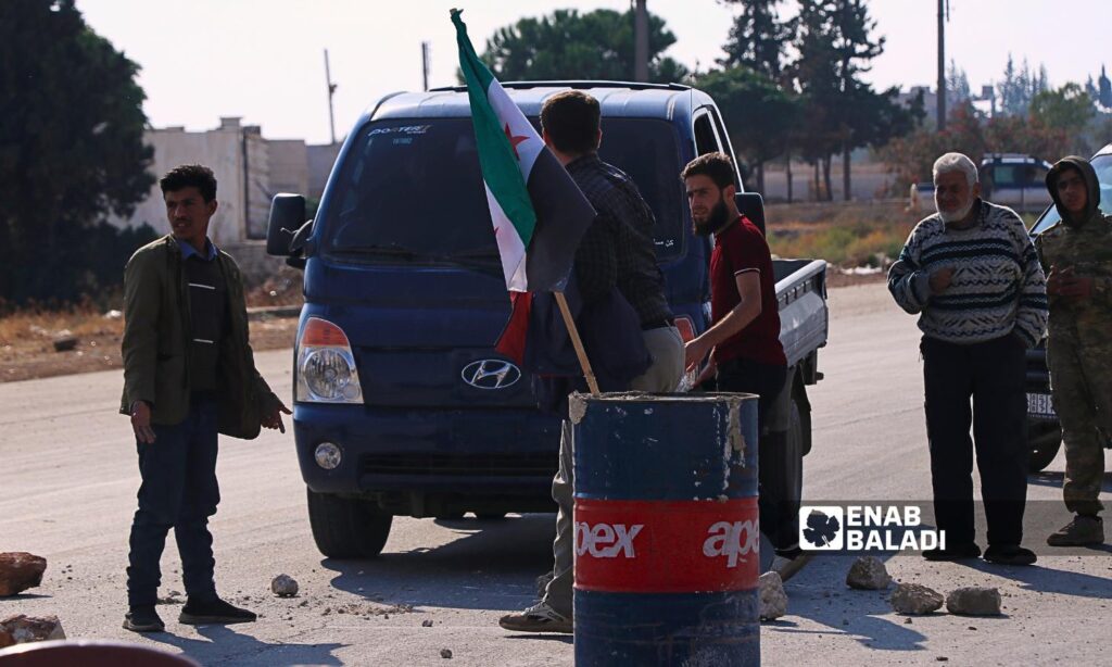 Protesters blocked the Abu al-Zandeen crossing road between areas controlled by the regime and the opposition near the city of al-Bab, eastern Aleppo - November 4, 2024 (Enab Baladi/Walid al-Idlibi)