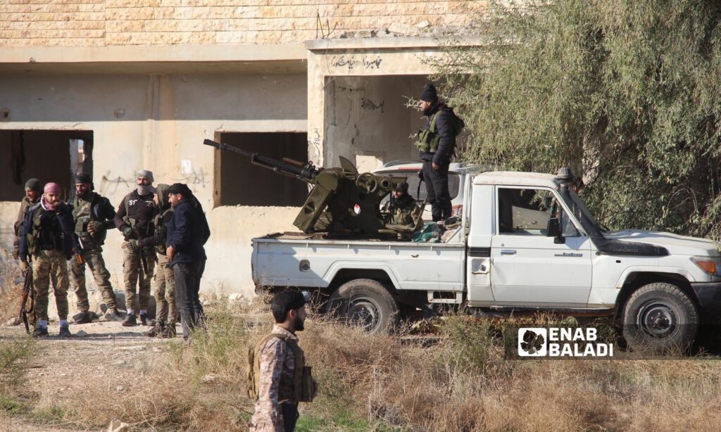 Fighters from the Syrian opposition factions after the capture of the city of Saraqib and heading towards the southern Idlib countryside - November 30, 2024 (Enab Baladi/Iyad Abdul Jawad)