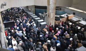 Crowds at the Syrian Commercial Bank wait in line to collect their financial grants - December 21, 2022 (Tishreen newspaper)
