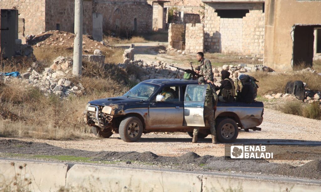 Fighters from the Syrian opposition factions after the capture of the city of Saraqib and heading towards the southern Idlib countryside - November 30, 2024 (Enab Baladi/Iyad Abdul Jawad)