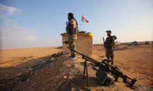 Elements of Iranian militias in al-Bukamal in Deir Ezzor countryside - February 2024 (AFP)