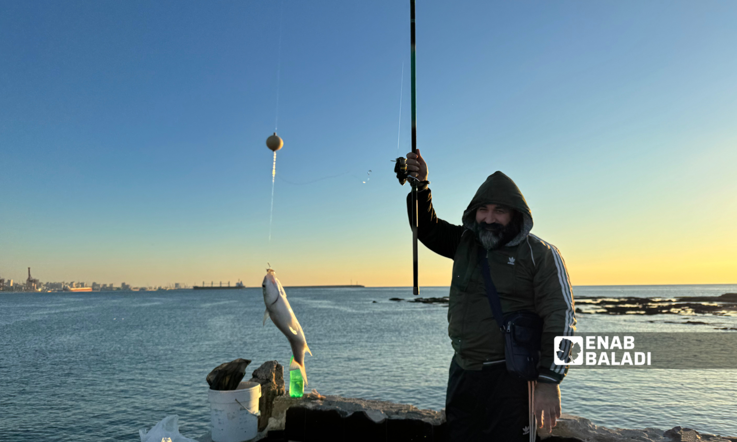 Fishing at Afamia beach in Latakia - December 21, 2024 (Enab Baladi/Dayan Junpaz)
