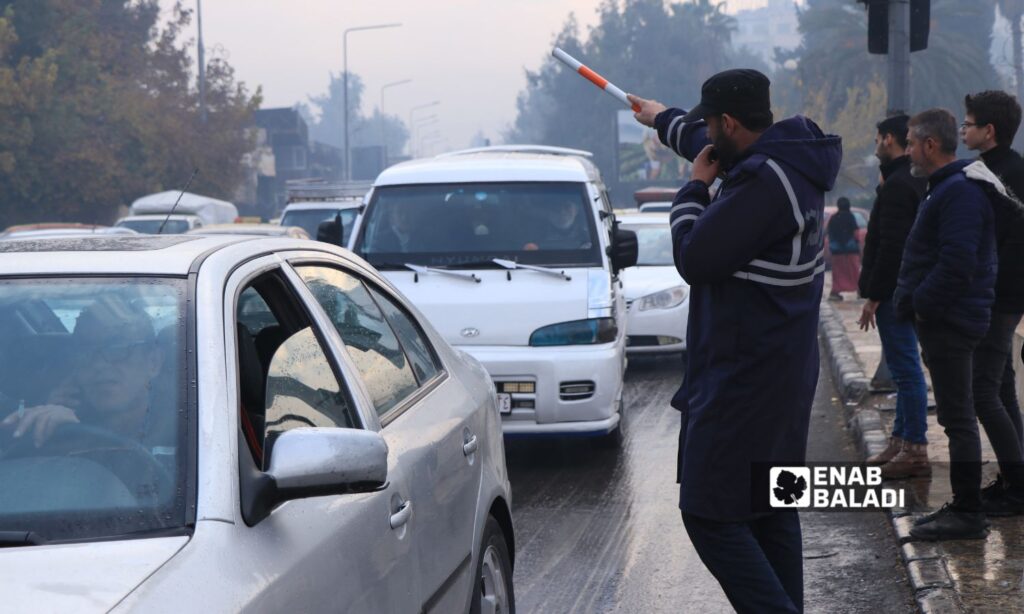 A traffic policeman directing traffic on a street in Aleppo - December 12, 2024 (Enab Baladi/Walid al-Idlibi)