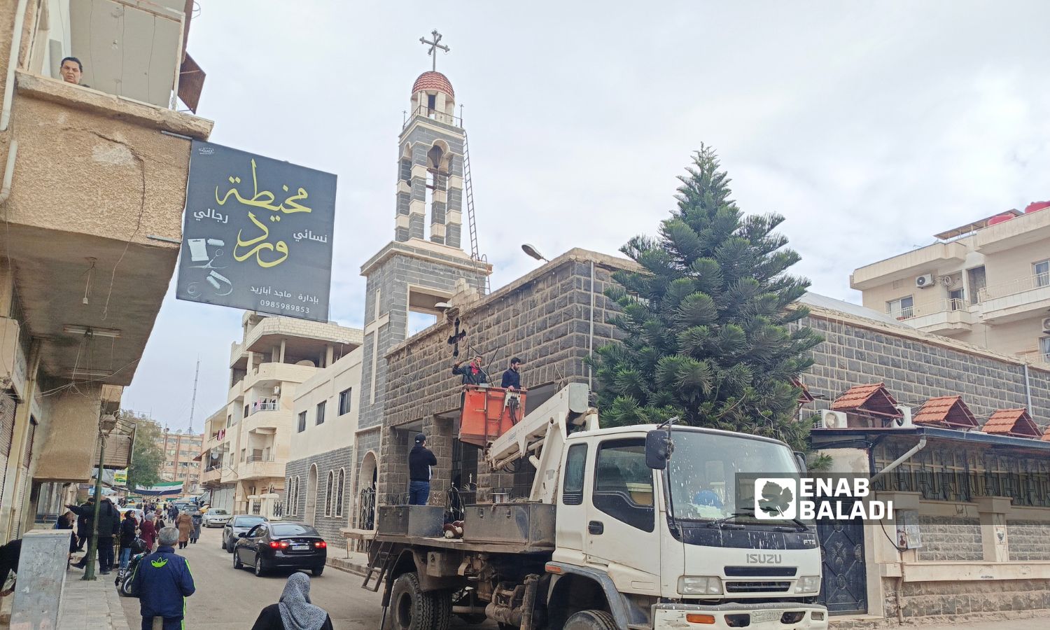 Local community campaign supervised by the Syrian Society for Social Development cleaning and decorating the church in the Shamal al-Khat neighbourhood of Daraa city - December 24, 2024 (Enab Baladi/Halim Muhammad)