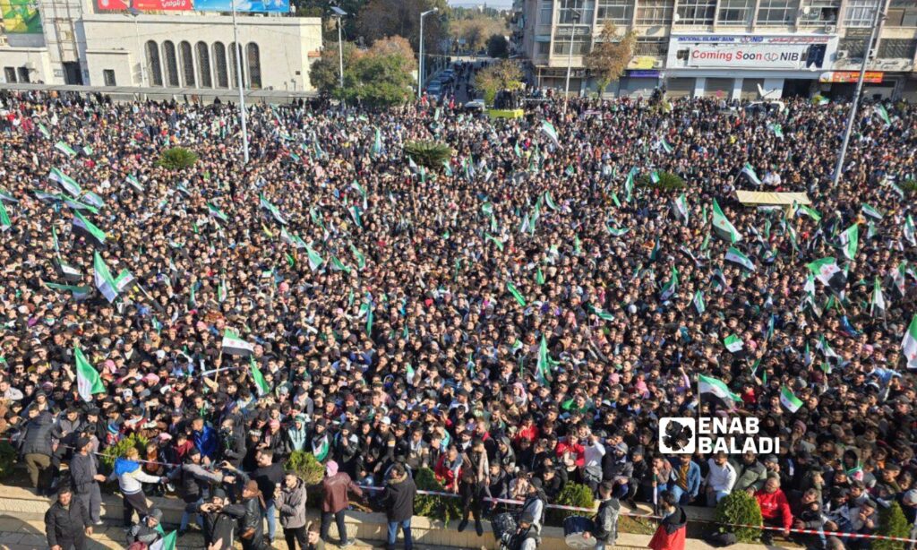 Thousands of Syrians in Hama celebrate the fall of the Assad regime - December 13, 2024 (Enab Baladi/Iyad Abdul Jawad)