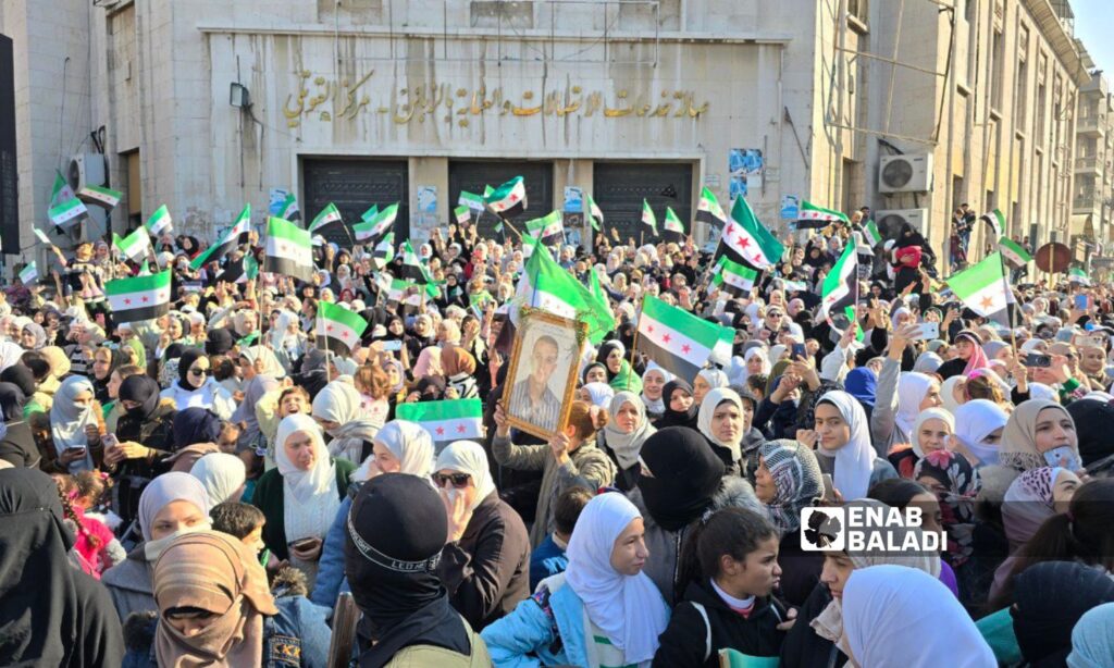 Thousands of Syrians in Hama celebrate the fall of the Assad regime - December 13, 2024 (Enab Baladi/Iyad Abdul Jawad)