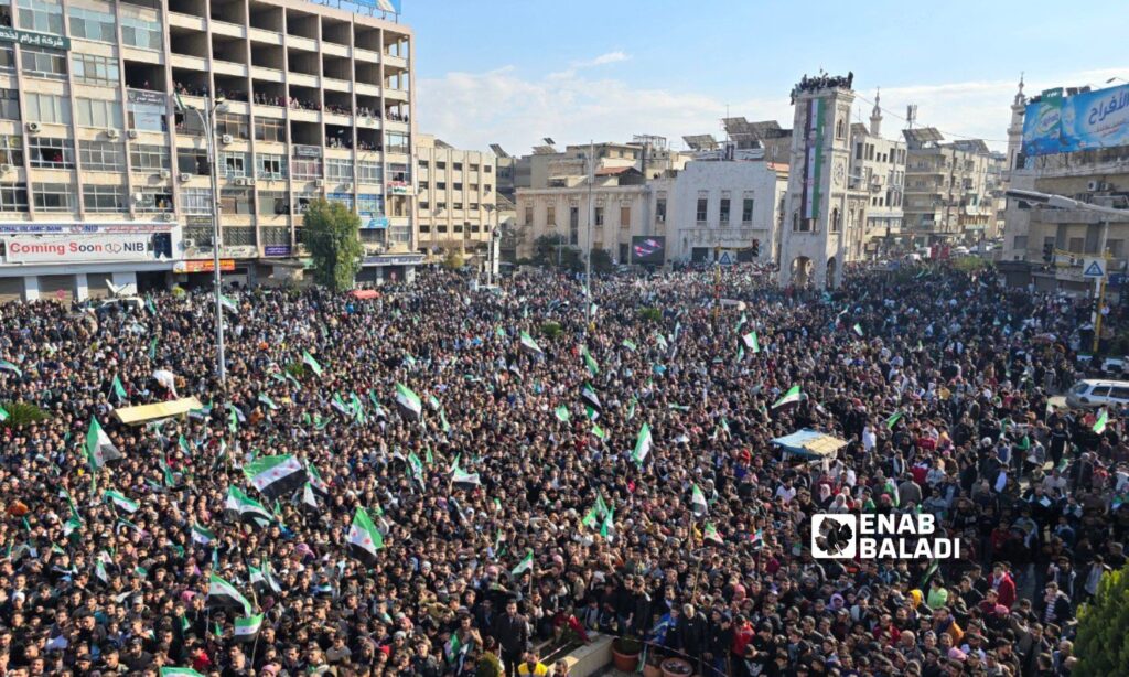 Thousands of Syrians in Hama celebrate the fall of the Assad regime - December 13, 2024 (Enab Baladi/Iyad Abdul Jawad)