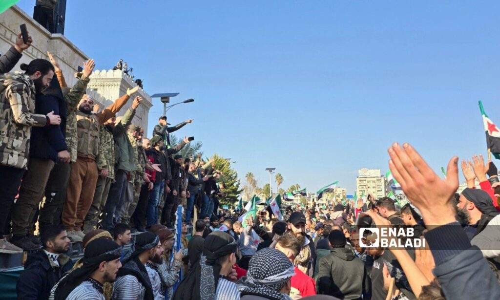 Thousands of Syrians in Hama celebrate the fall of the Assad regime - December 13, 2024 (Enab Baladi/Iyad Abdul Jawad)