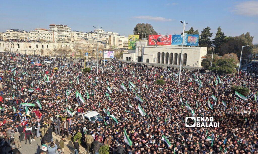 Thousands of Syrians in Hama celebrate the fall of the Assad regime - December 13, 2024 (Enab Baladi/Iyad Abdul Jawad)