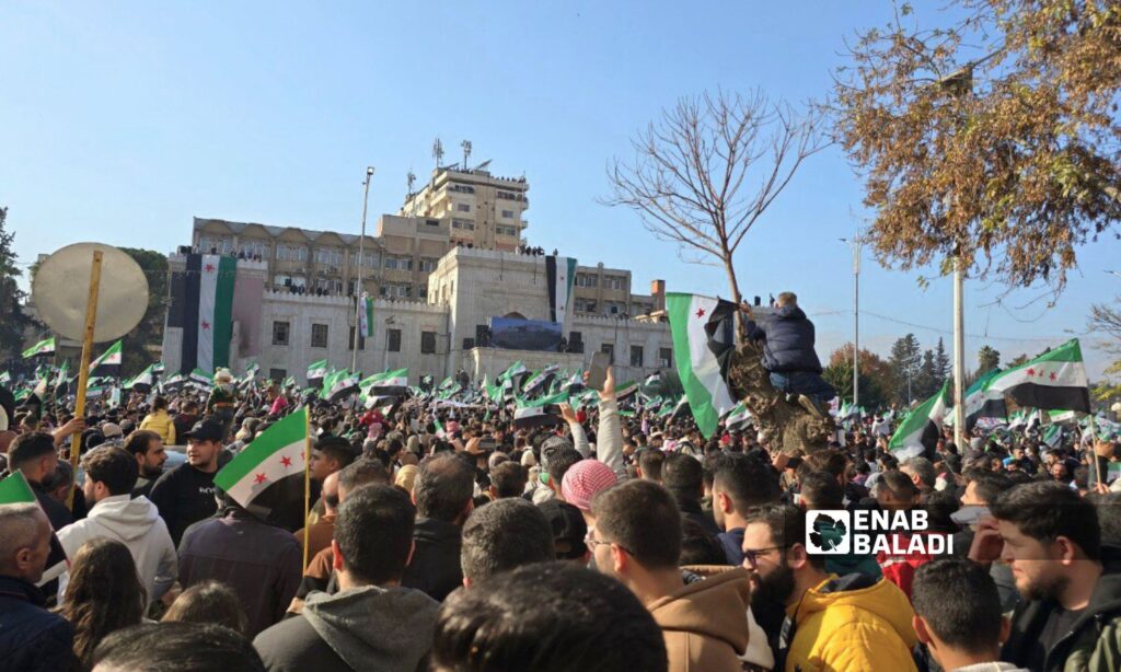 Thousands of Syrians in Hama celebrate the fall of the Assad regime - December 13, 2024 (Enab Baladi/Iyad Abdul Jawad)