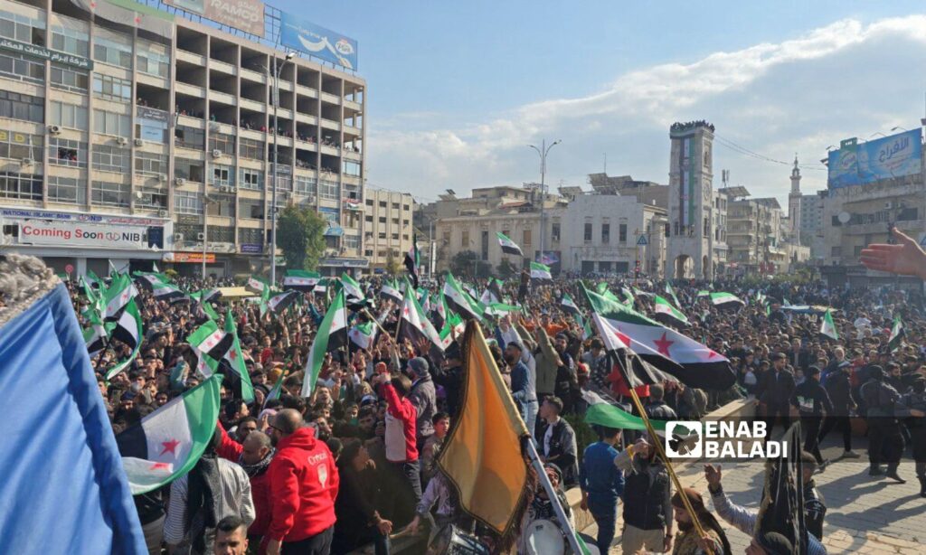 Thousands of Syrians in Hama celebrate the fall of the Assad regime - December 13, 2024 (Enab Baladi/Iyad Abdul Jawad)