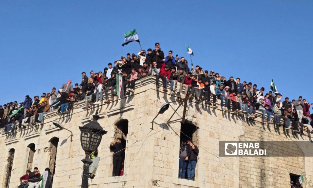 Thousands of Syrians in Hama celebrate the fall of the Assad regime - December 13, 2024 (Enab Baladi/Iyad Abdul Jawad)