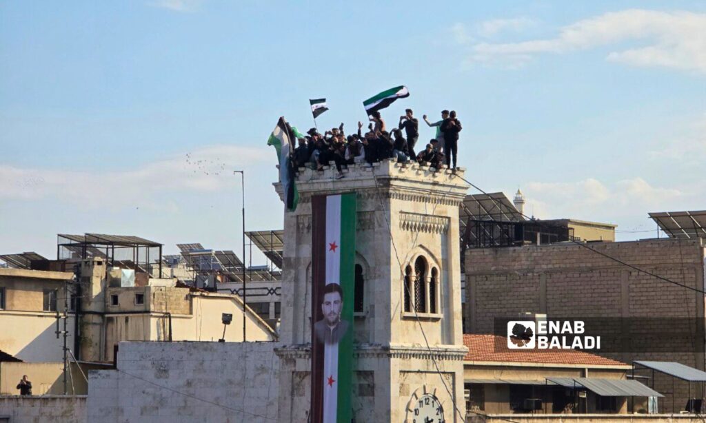 Thousands of Syrians in Hama celebrate the fall of the Assad regime - December 13, 2024 (Enab Baladi/Iyad Abdul Jawad)