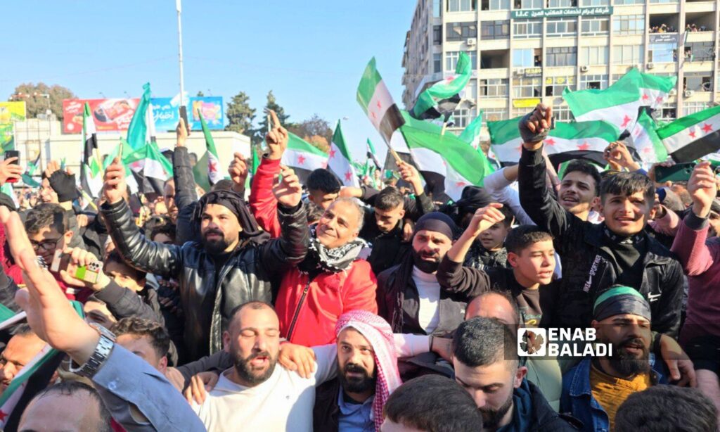 Thousands of Syrians in Hama celebrate the fall of the Assad regime - December 13, 2024 (Enab Baladi/Iyad Abdul Jawad)