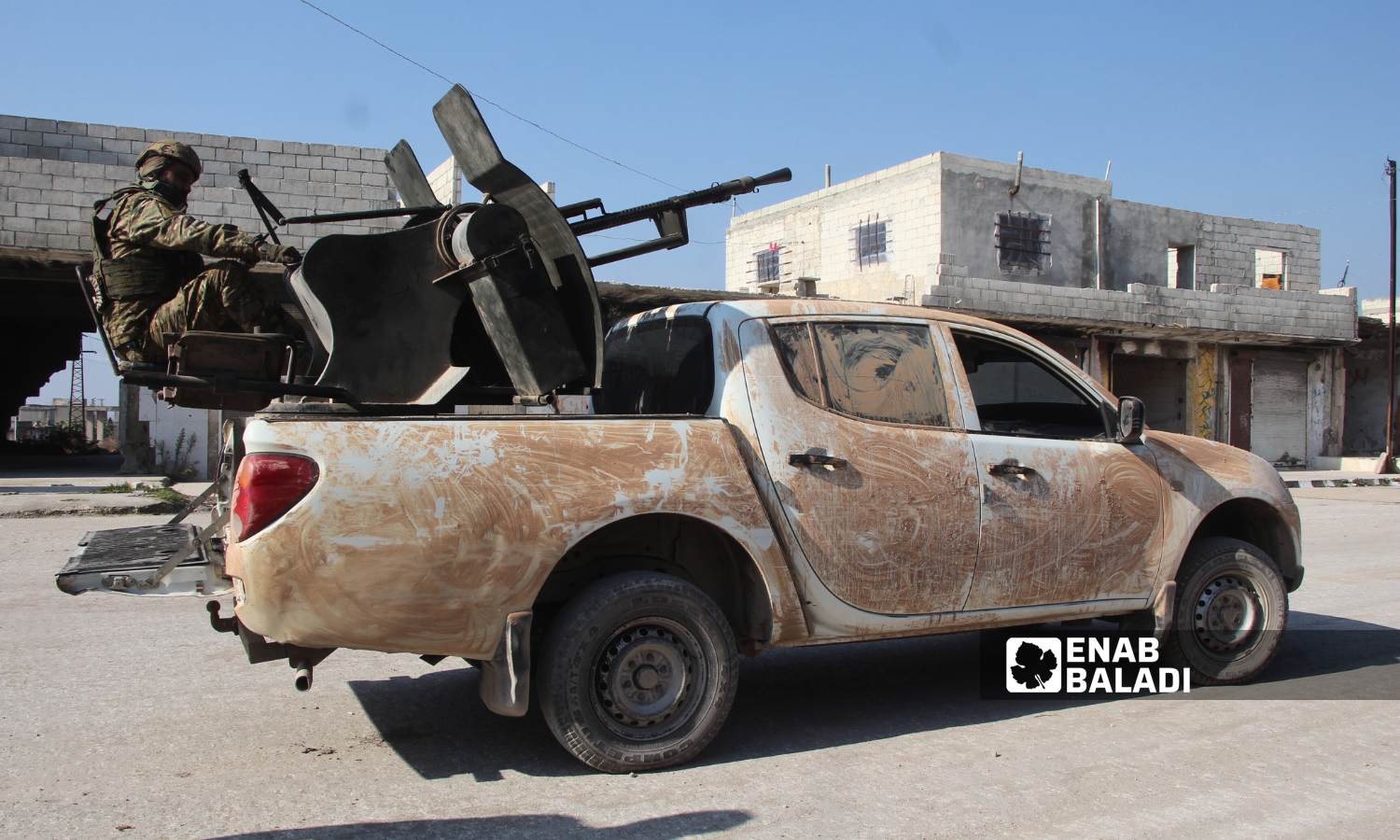 Fighters from the opposition factions in the town of Qalaat al-Madiq after taking control of it - December 3, 2024 (Enab Baladi/Iyad Abdul Jawad)
