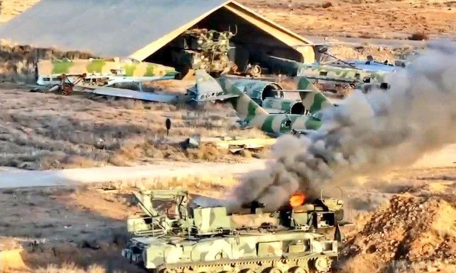 A burnt tank inside the Mazzeh Military Airport in the capital, Damascus - December 9, 2024 (Sawt al-Asima)