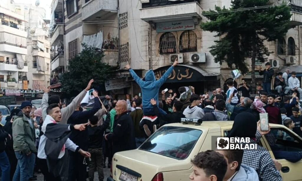 Dozens gathered in the neighborhoods of Latakia to celebrate the fall of Bashar al-Assad - December 10, 2024 (Enab Baladi)