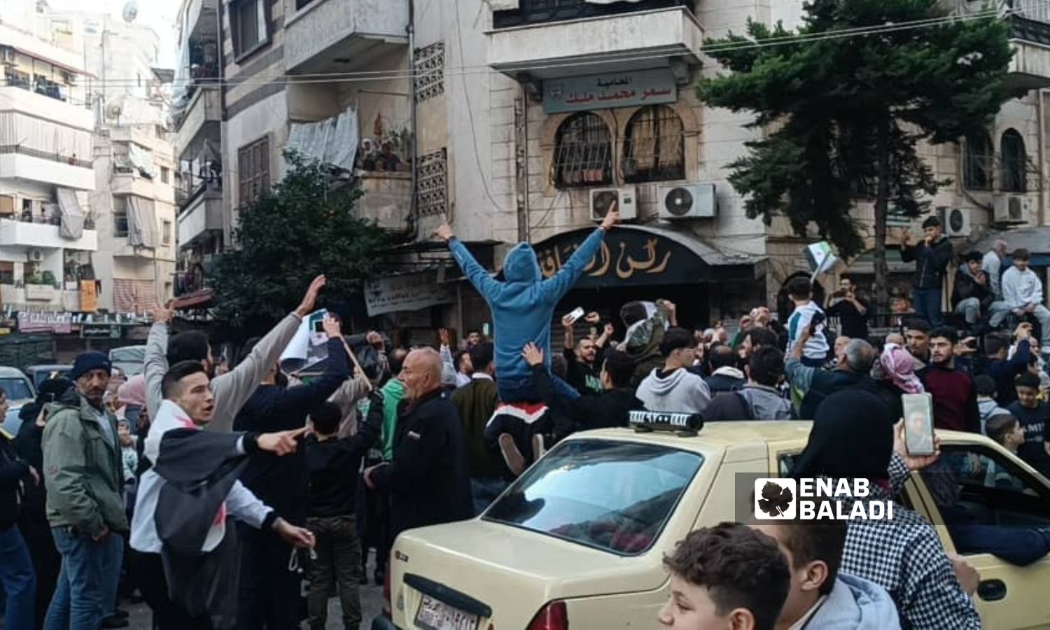 Dozens gathered in the neighborhoods of Latakia to celebrate the fall of Bashar al-Assad - December 10, 2024 (Enab Baladi)
