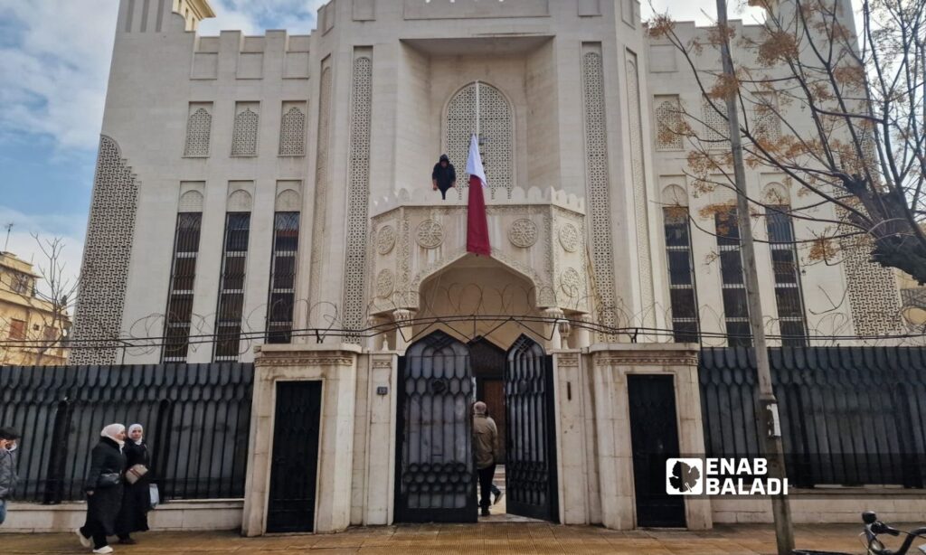 The Qatari flag at the Qatari embassy building in the Abu Rummaneh neighborhood of the Syrian capital, Damascus - December 21, 2024 (Enab Baladi/Anas al-Khouli)