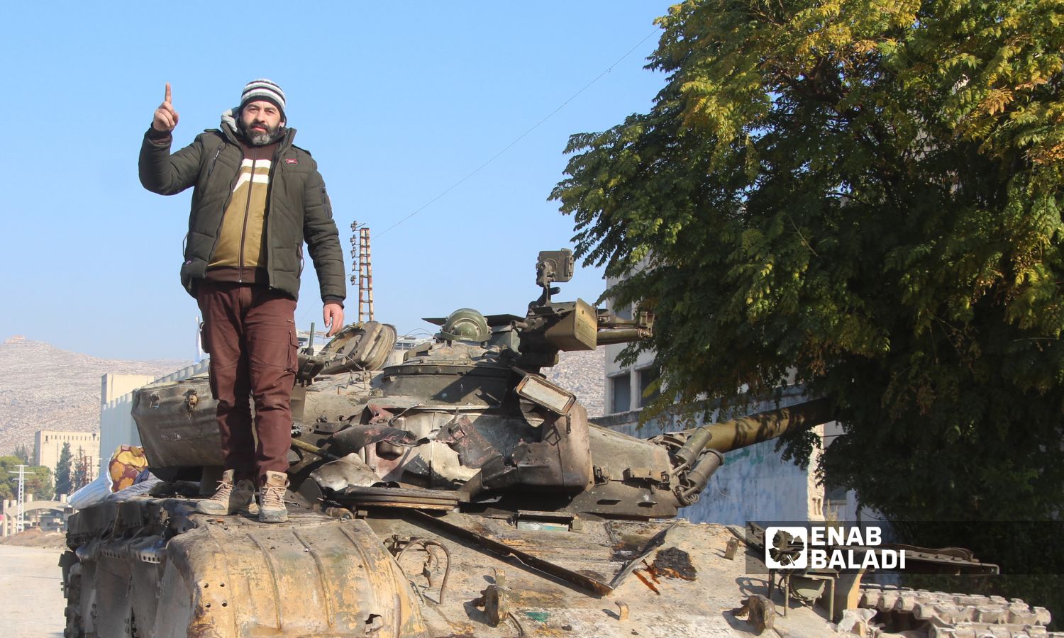 Opposition fighters after their control of Qalaat al-Madiq in the countryside of Hama - December 3, 2024 (Enab Baladi/Iyad Abdul Jawad)